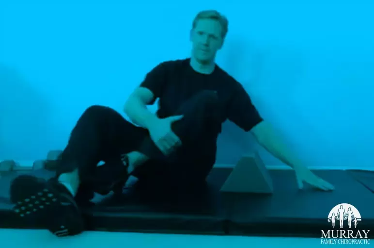 Dr. Rob Murray showing stretch for lumbar traction